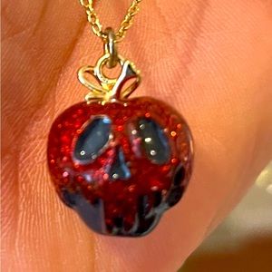 Disney Coach poisoned apple necklace.